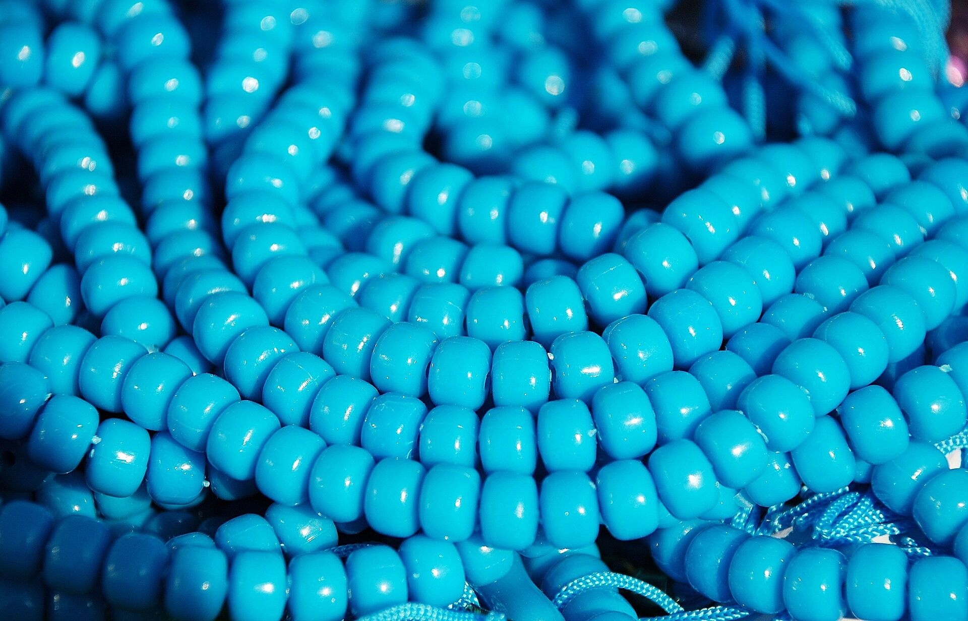 Image of blue beads strung on a necklace