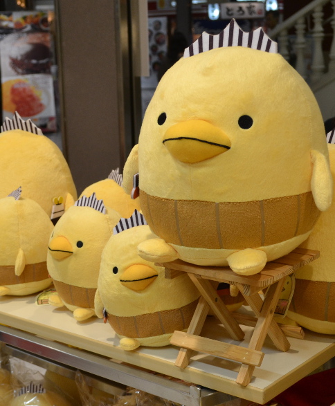 Figure 8.  “Bari-san” yuru-kyara stuffed “animals” for sale. Bari-san is associated with Imabari City in Ehime Prefecture, famous for its chicken products. Photograph by author, 2013.