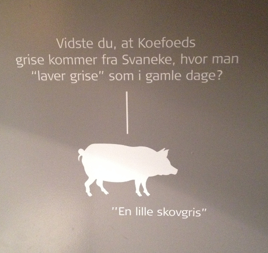 Figure 4. Toilet door poster: “Did you know that Koefoed’s pigs come from Svaneke where they “make pigs” as in the old days? --- “a small forest pig” (photographed by Karrebæk)
