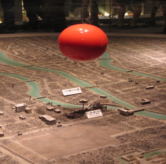 Figure 7. Diorama of Atomic Bomb Blast over Hiroshima, the red sphere representing the bomb blast one second after detonation (Peace Memorial Museum, Hiroshima, Japan). Photo by Steven Feld.