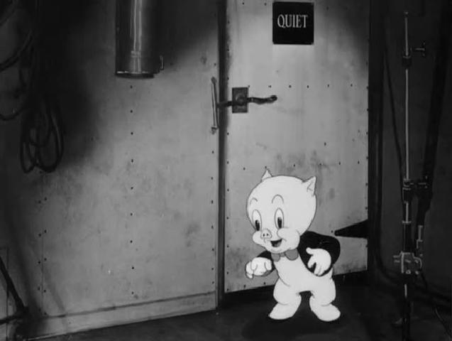 Figure 6. An animated Porky Pig trying (and ultimately failing) to be unobtrusive on a live-action soundstage in You Ought to Be in Pictures (1940).