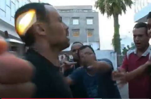 Figure 7. Factory workers stopping young man from self-immolating, <em>Sans plomb</em> (Sami Tlili, 2006)